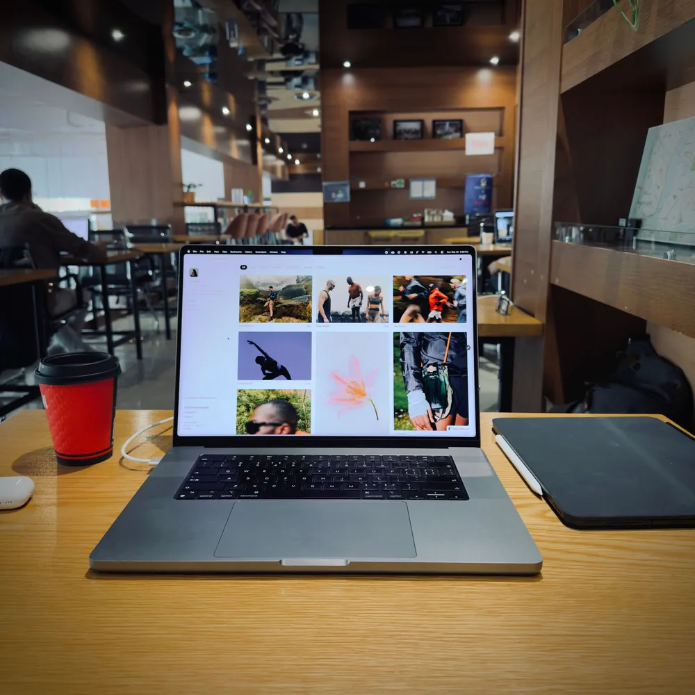 A MacBook on a café table with the Hansler template open